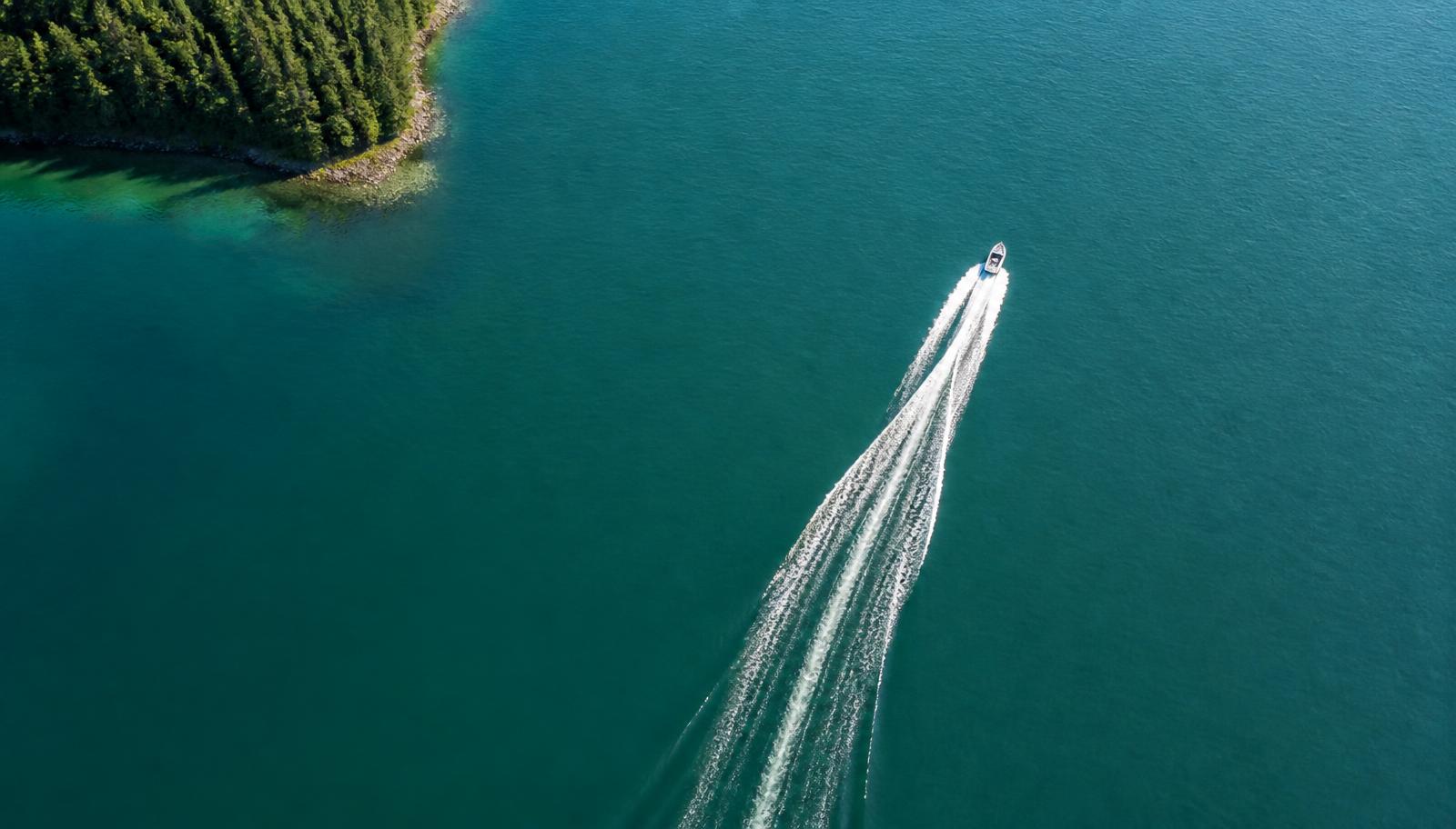 Aerial view of boats on a clear blue lake